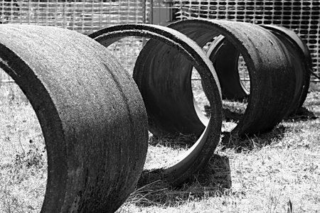 Cement pipes are laid on the grass