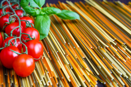 Colored spaghetti pasta with herbの写真素材
