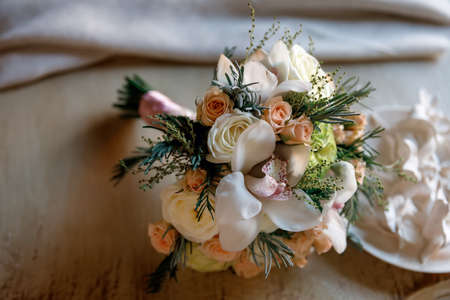 bridal bouquet of different flowers in light pastel colorsの写真素材