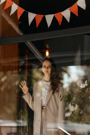 young woman in white pantsuit and white t-shirt in city location