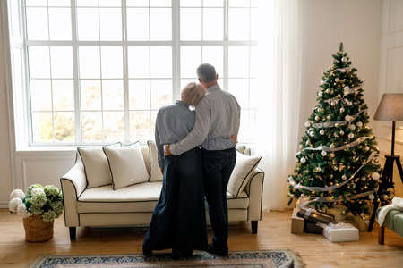 old man hugs his wifeの写真素材