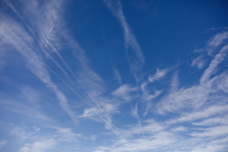cloudy sky striped clouds on blue background