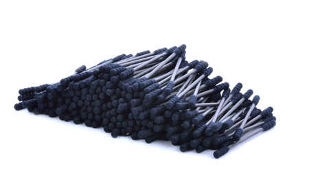 Cotton sticks,cotton wool,black-color on white background.の写真素材