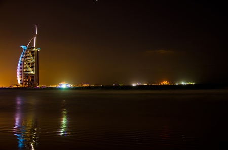 DUBAI - JANUARY 4: Burj al Arab hotel, one of the few 7 stars hotel in the world and one of the most recognized luxury symbol at night on JANUARY 4, 2012 in Dubai, United Arab Emiratesのeditorial素材