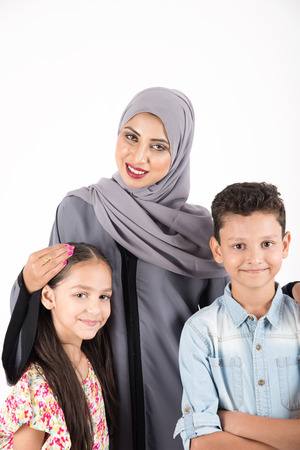 Arab family standing on white backgroundの写真素材