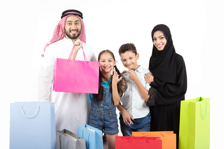 Arab muslim family shopping on white backgroundの写真素材
