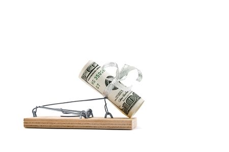 Mousetrap with hundred bucks is isolated against a white backgroundの写真素材