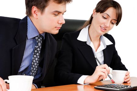Business team calculating at a meeting against white backgroundの写真素材