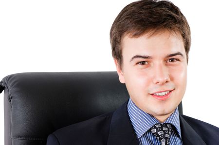 Portrait of a smiling businessman against white backgroundの写真素材