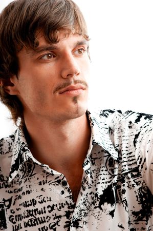 Portrait of stylish young man thinking about the future against white backgroundの写真素材