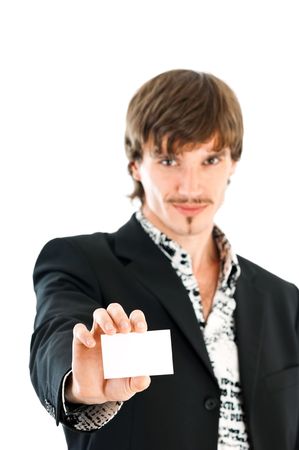 Stylish business man handing a blank business card over white backgroundの写真素材