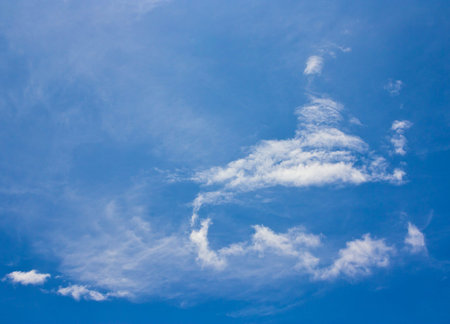 White fancy clouds and blue sky background