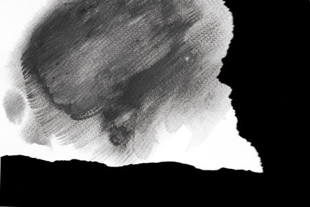 Torn white paper with black watercolor の写真素材