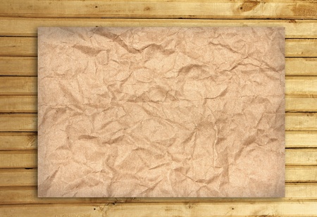 Wrinkled paper on Wood panels for backgroundの写真素材