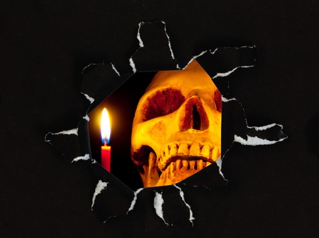 scary skull in Black paper hole, Halloween concept2の写真素材