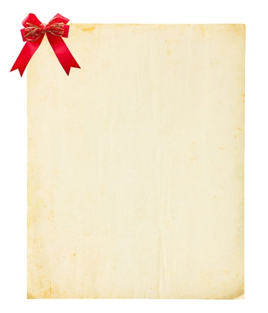 Vintage old paper and red bow on white backgroundの写真素材