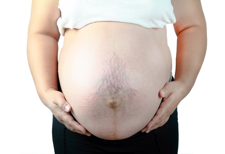 Pregnant woman on white backgroundの写真素材