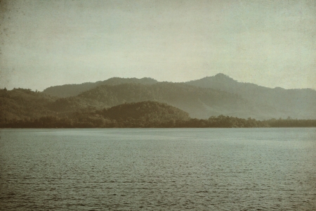 Sea and mountain grunge style for background の写真素材