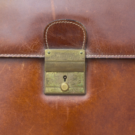 Close-up of lock on leather business case ,for backgroundの写真素材