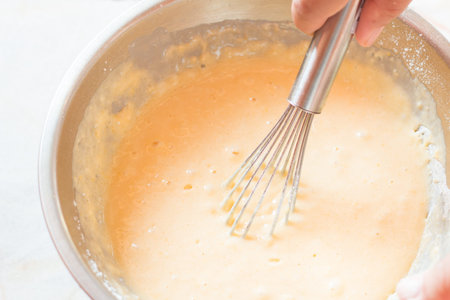 Whisking eggs in bolw