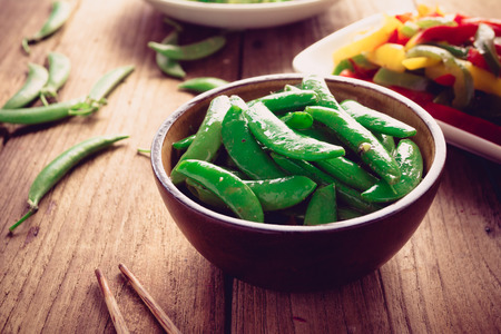 Peas salad on old wood background, Vegetarian foodの写真素材