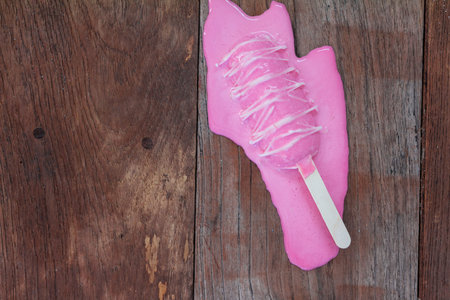 Melting ice cream on old wood