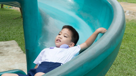 Thai boy on the slideの写真素材