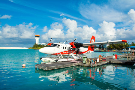MALE, MALDIVES - JULY 04 2017: hydroplane near the wooden pier at the Male airport, Maldives, July 04, 2017のeditorial素材