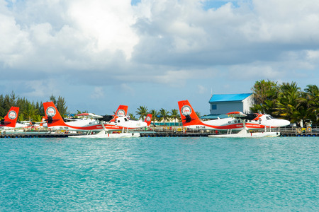 MALE, MALDIVES - JULY 04 2017: hydroplane near the wooden pier at the Male airport, Maldives, July 04, 2017のeditorial素材