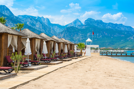 Antalya, Turkey - 10 May 2018: Wooden beach pavilions on the shore of a sandy beach - the Mediterranean coast, Beldibi, Antalya, Turkeyのeditorial素材