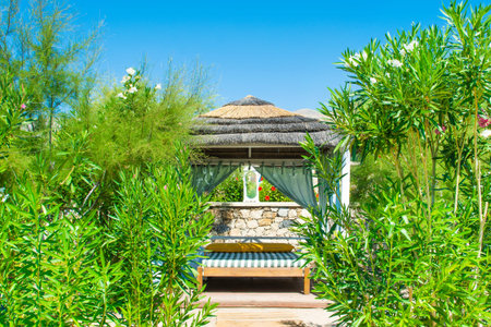 Wooden beach pavilion on the shore of a rocky beach, Rhodes, island, Greeceの写真素材