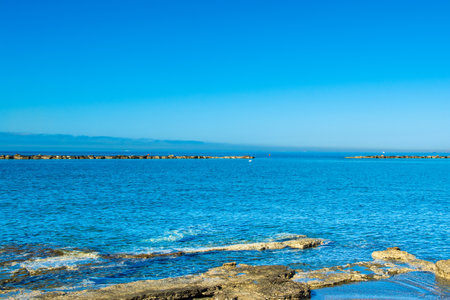 Sunrise beach landscape on the Mediterranean coast on Cyprus islandの写真素材
