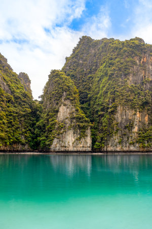 Beautiful tropical landscape of the Maya Bay in the Phi Phi Islands in Thailand - one of the most famous places with paradise views, sandy beach and green rocksの写真素材