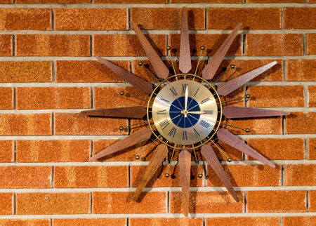 Vintage clock on a brickwall full view of clockの写真素材