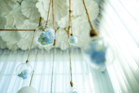 Flowers in a clear glass jar Hanging on the ceiling.