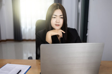 Work form home concept, Bussiness woman working discussing the charts. Asian woman.