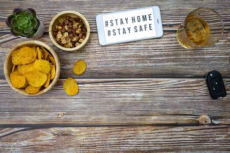 Smartphone screen with text hashtag #STAY HOME and #STAY SAFE.の写真素材