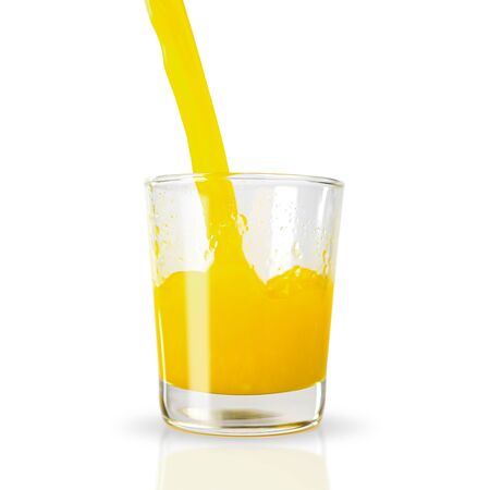 Pour the squeezed orange juice into a low-clear glass. with clipping paths.の写真素材