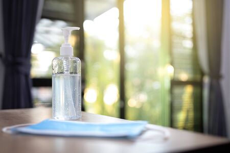 Coronavirus prevention medical surgical masks and hand sanitizer gel for hand.の写真素材