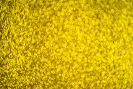 gold glitter, gold bokeh texture for christmas abstract background.の写真素材