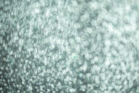 Silver glitter, silver bokeh texture for christmas abstract background.の写真素材