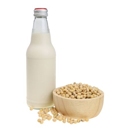 Soy milk bottle And soy beans in a wooden bowl isolated on white background. with clipping paths.の写真素材