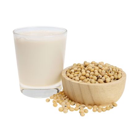 A glass of soy milk And soy beans in a wooden bowl isolated on white background. with clipping paths.の写真素材