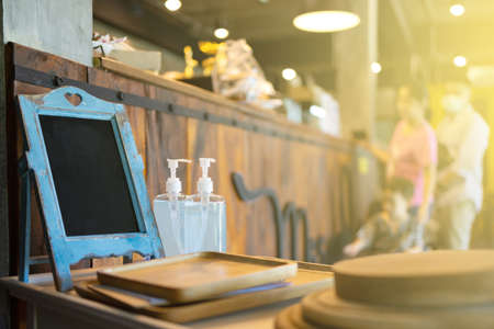 Cold coffee mug with white label for logo blurred coffee shop background.の写真素材