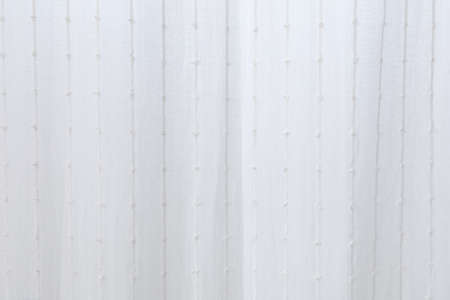 Thin white curtains filter the light. white background for wallpaper.の写真素材