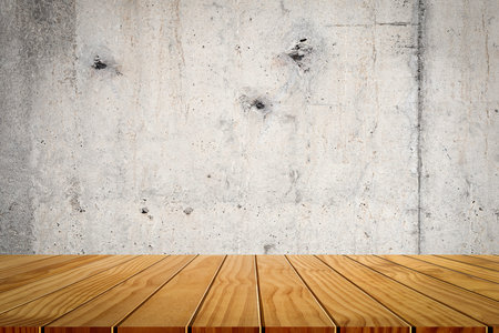 Wooden tabletop template mockup for display merchandise. wooden shelf table isolated on concrete background.の写真素材