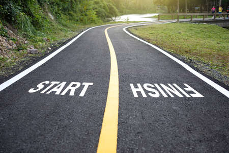 Beautiful park with jogging track with white text START and FINISH.の写真素材