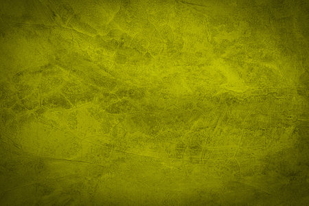 Yellow and orange background texture with distressed vintage grunge and shiny spotlight corner design.の写真素材