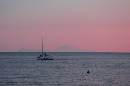 Capri Island silhouette on amazing colorful sunset time. View from the coast of Naples, Italy. Tourism in Europeの写真素材