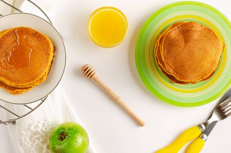 Decicious American pancakes with honey on white background. Healthy breakfast.の写真素材